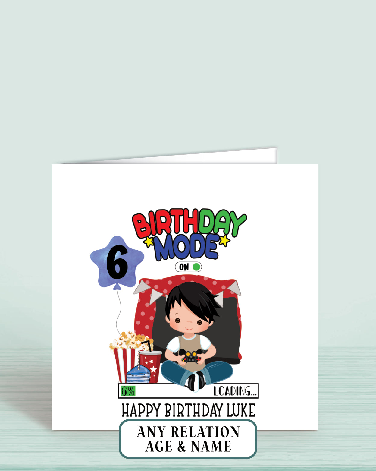 Boys Gaming Birthday card with a black haired cartoon character boy and text reading: Birthday Mode on, Happy Birthday (Name) and age 6 on printed a blue balloon