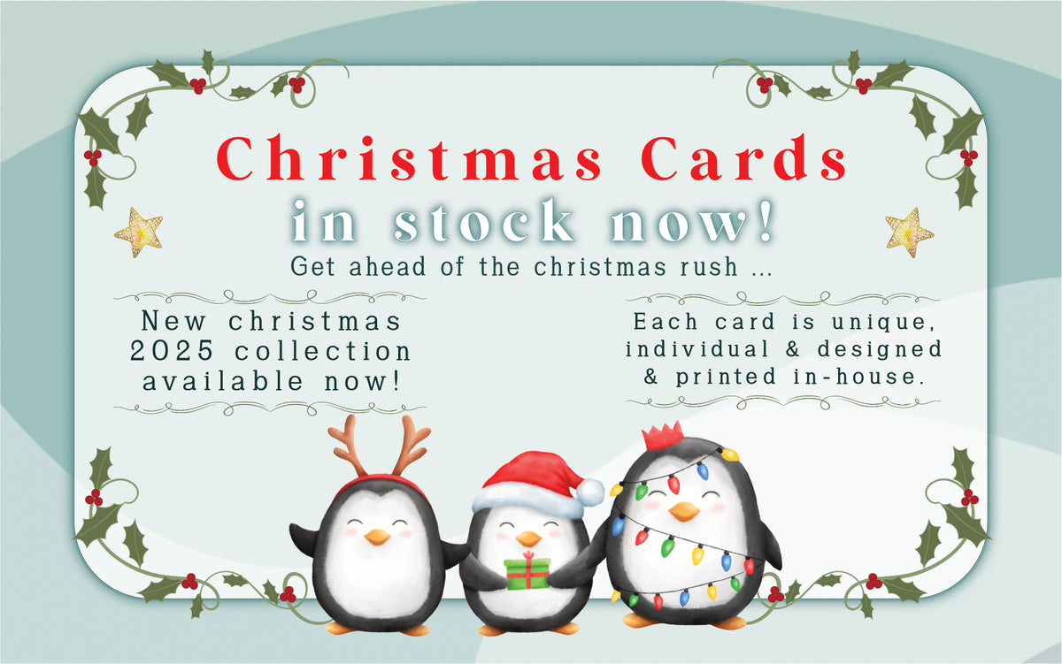 Advertisement for Christmas cards with penguin illustrations on a green background.