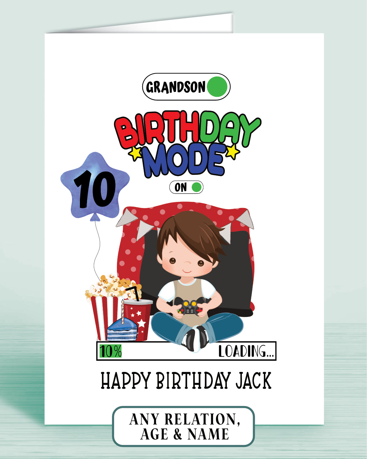 Birthday card with a cartoon boy with Brown Hair, popcorn, and video game controller & a blue birthday balloon with age 10 as example.