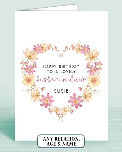 Personalised Pink and yellow floral wreath birthday card for a lovely Sister-in-law with floral design on a white background.
