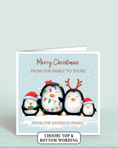 Personalised Christmas card with four cheeky penguins holding christmas lights on a light blue snowy background, 6x6 inches with envelope