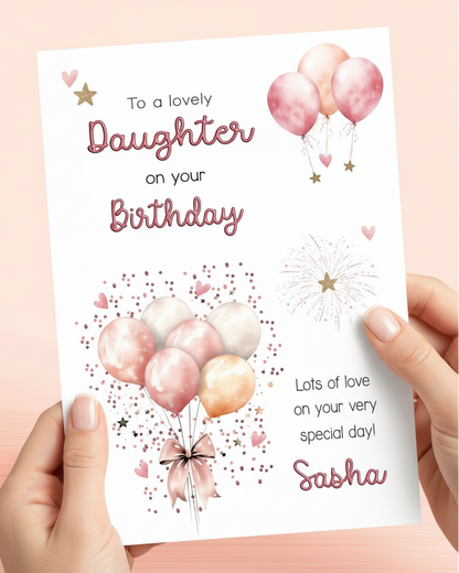 Lifestyle image of hands holding a Daughter Pink Balloons Birthday Card, to a lovely Daughter on your Birthday, Lots of love on your very special day! Add name if required. AI assisted image.