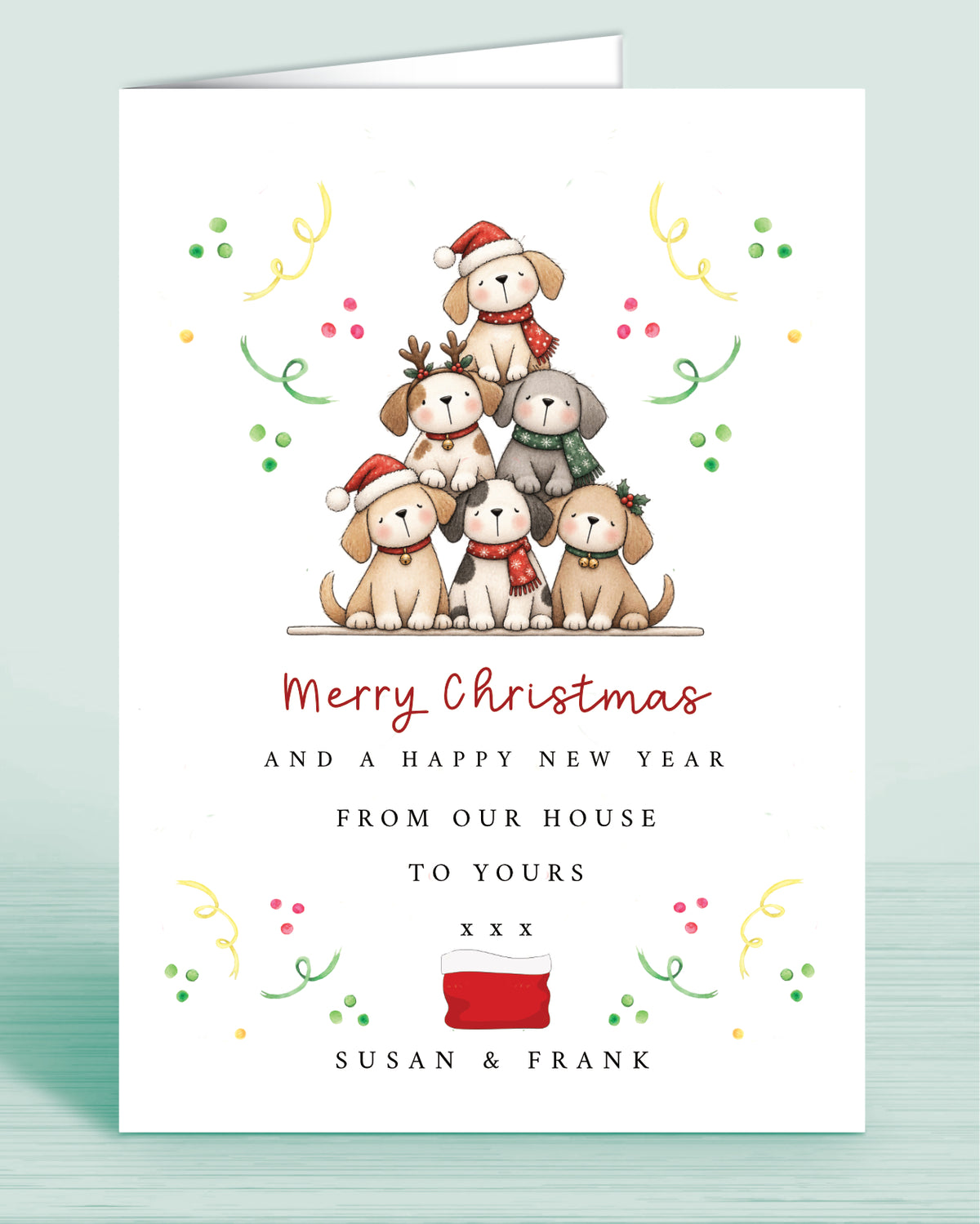 A Dog Lovers christmas card with a stack of christmas tree shaped Puppies and text underneath that reads: Merry Christmas and a happy new year from our house to yours xxx - Name(s) are optional.