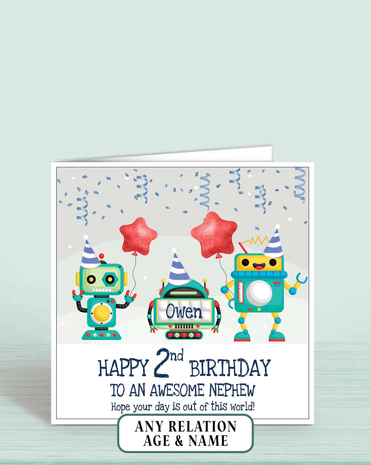 Birthday card with robots holding balloons and text on a light grey background. Reads: Happy 2nd Birthday to an awesome Nephew Hope your day is out of this world, add childs name if required | Oliver Rose Designs