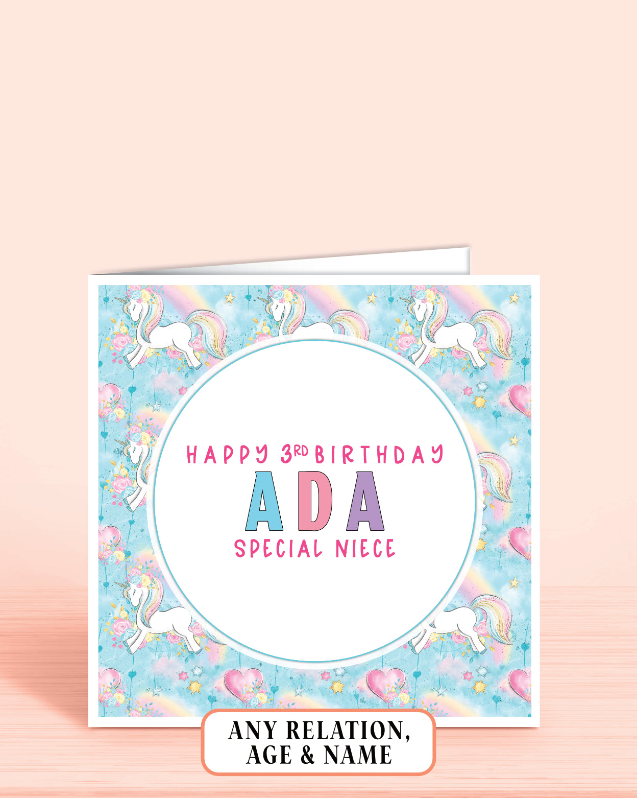 Personalized Niece birthday card with unicorns and rainbow on a light blue background