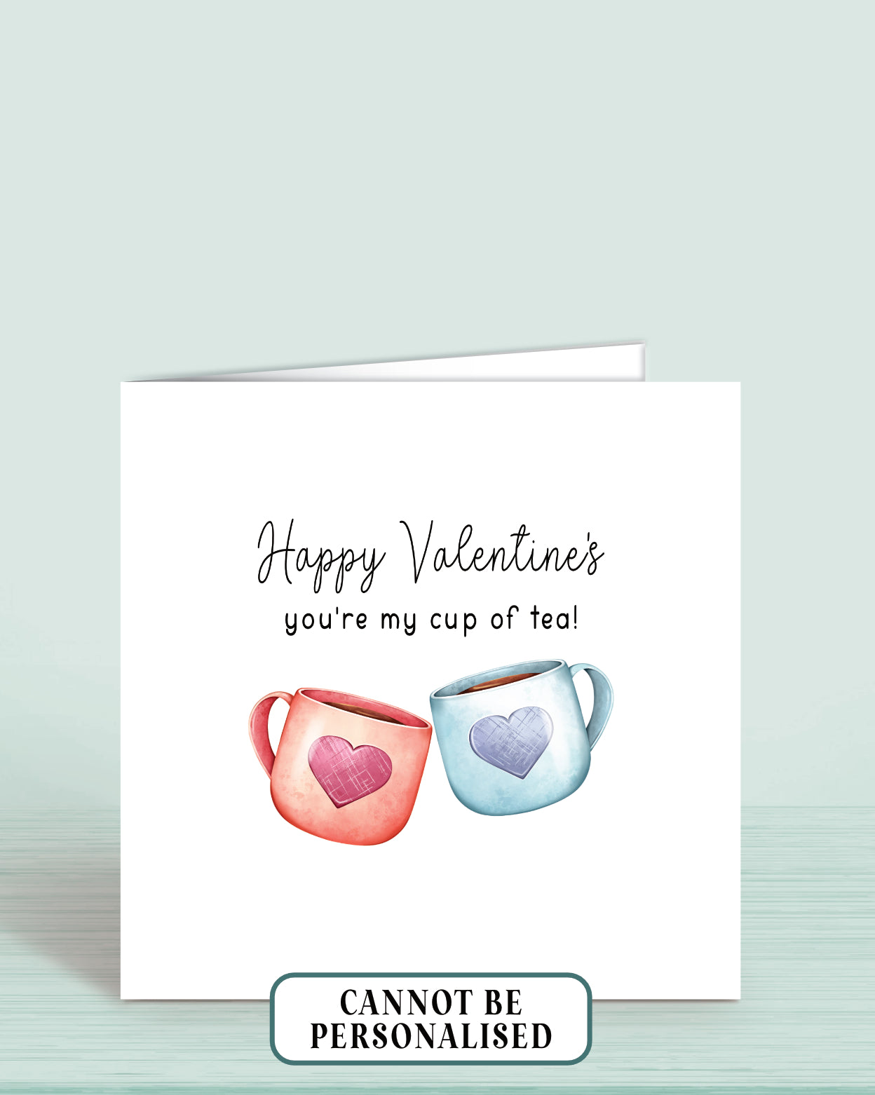 A Valentine's Day Card with an illustration of two cups of tea, one red and one blue (with a heart on each). wording: Happy Valentine's, you're my cup of tea!